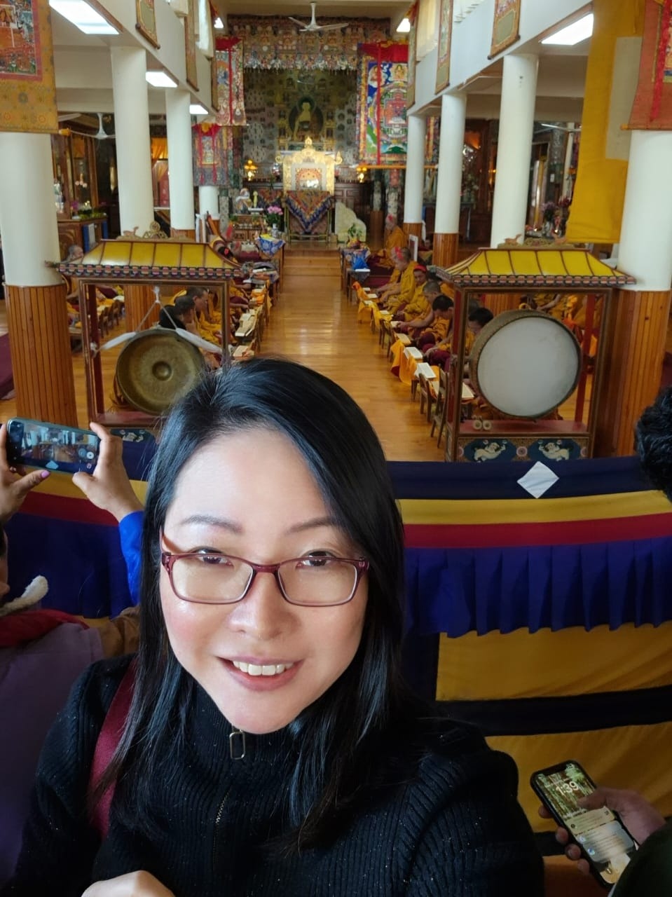 Camilla at a temple with meditation hall