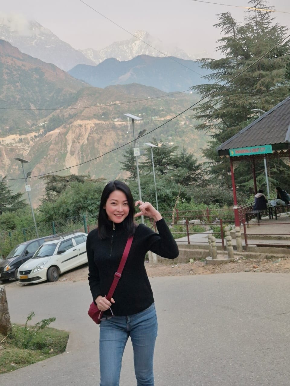 Camilla with mountain landscape in Dharamshala